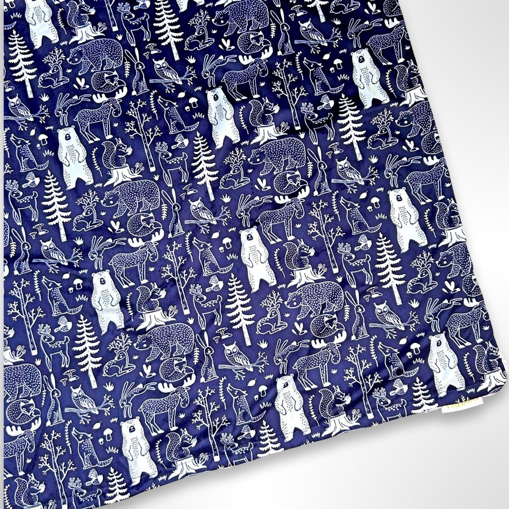 Double layer minky fleece blanket with forest animals on a navy blue background ready to be personalised with an embroidered name