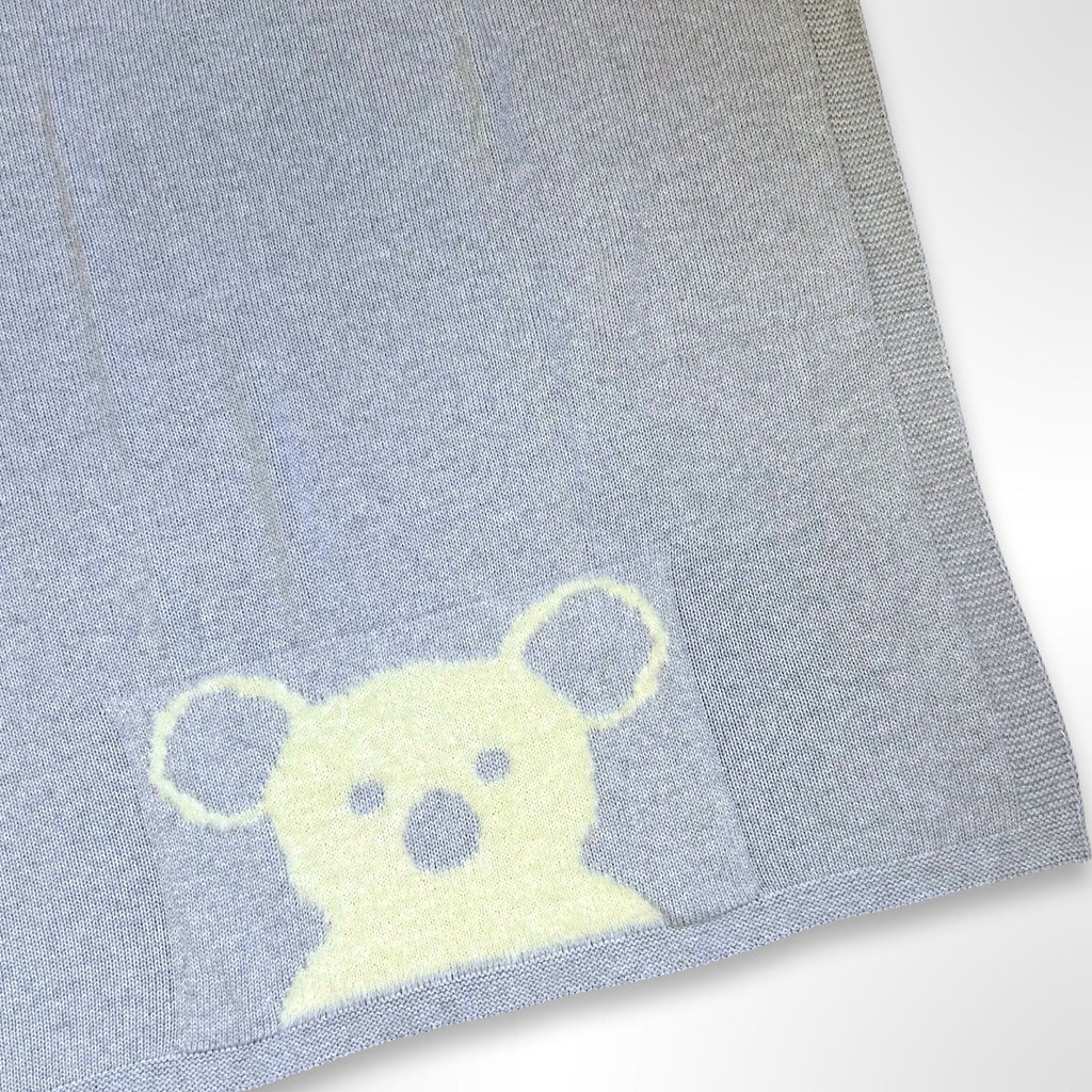 Grey knit baby blanket with a white koala face at the bottom in the centre, ready to be personalised with a name using embroidery.