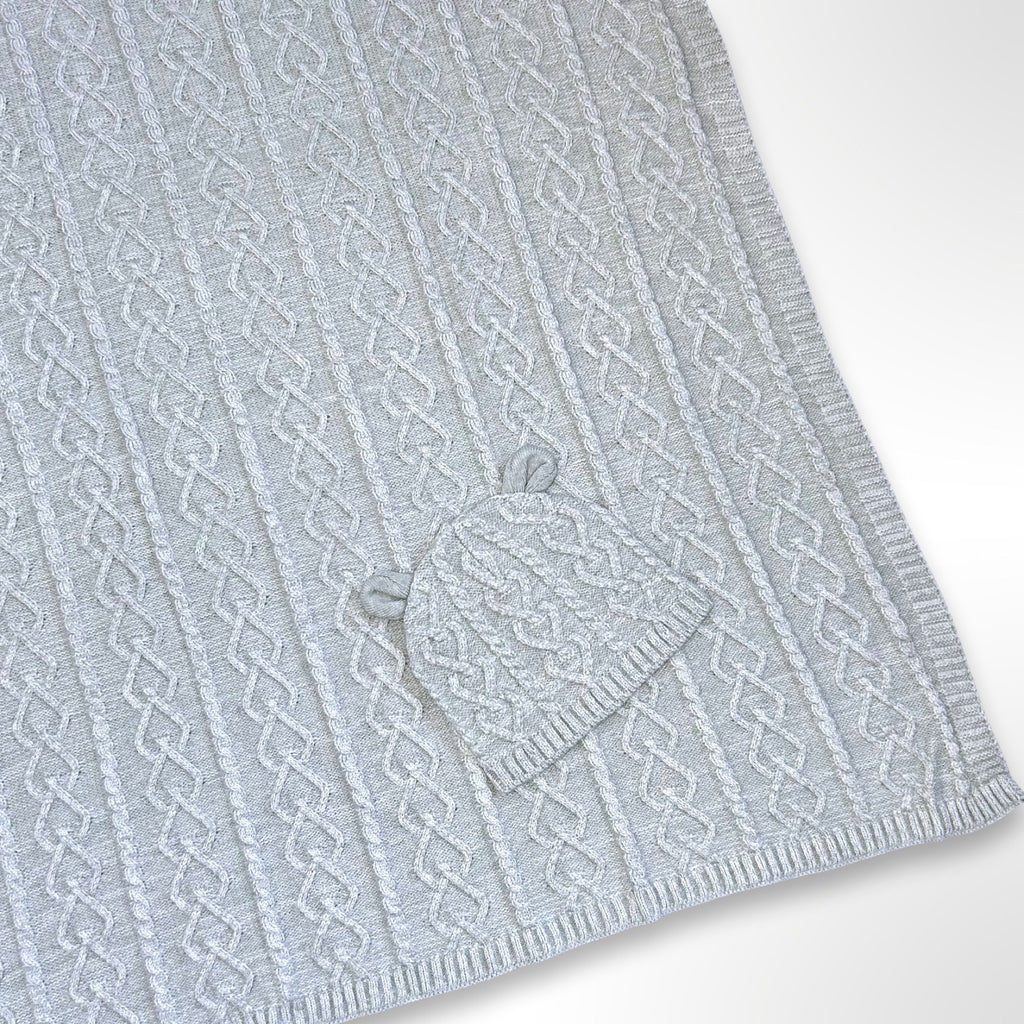 Grey cable knit blanket with matching beanie, ready to be personalised with a name using embroidery.