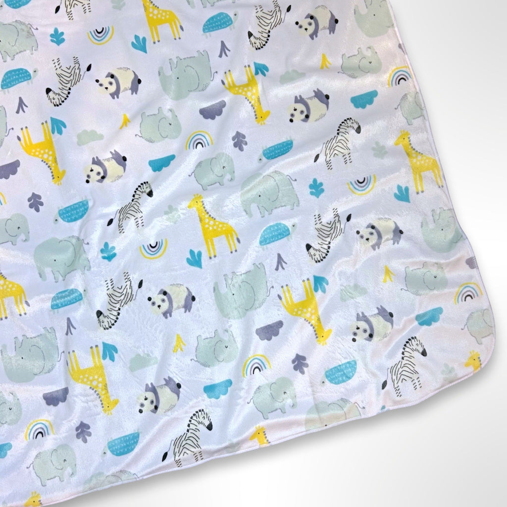 Minky blanket with zoo animals such as pandas, zebras, hippos, giraffes and elephants on a white background, ready to be personalised with a name using embroidery