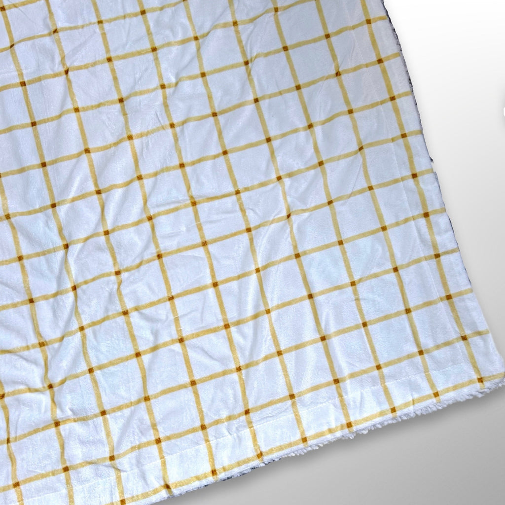 Double layer minky fleece blanket with a large tan and cream check pattern ready to be personalised with an embroidered name