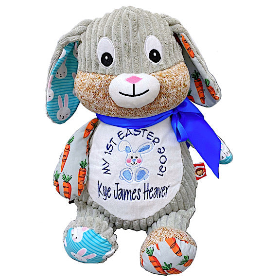 Grey harlequin bunny rabbit plushie teddy featuring orange carrot fabric and blue and white bunny fabric on the ears and limbs, personalised for my first easter 2021
