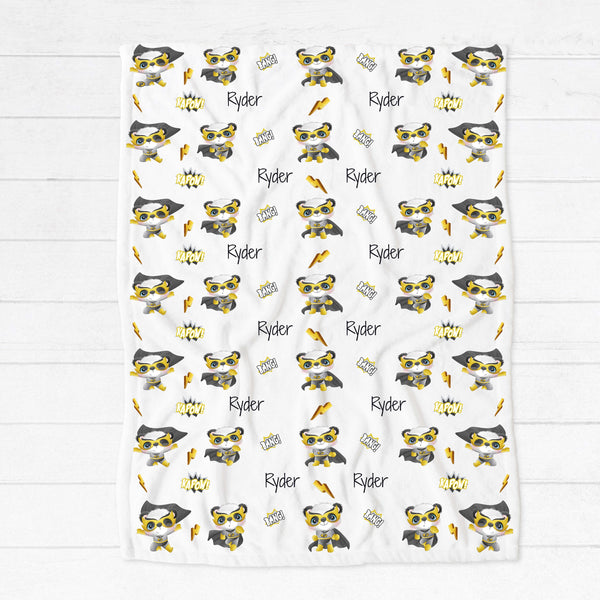 Personalised fleece minky blanket with a panda superhero in a yellow, black and  grey outfit