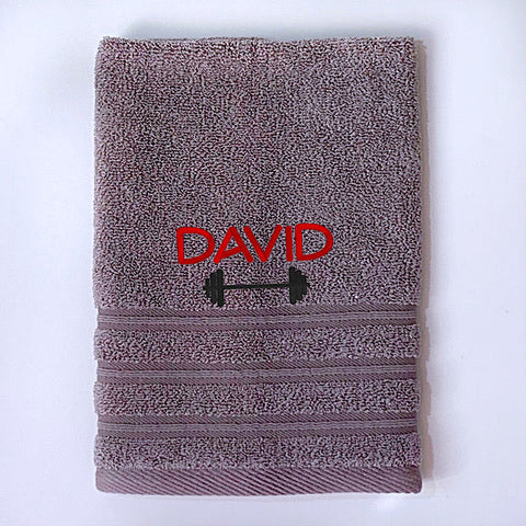 Grey gym towel or sports towel personalised with a name and dumbbell weight bar