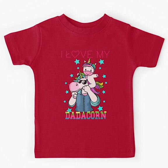 Red short sleeved kids tshirt with a muscly white father unicorn wearing a denim button down shirt with a baby unicorn on his shoulders with the words I love my dadacorn underneath