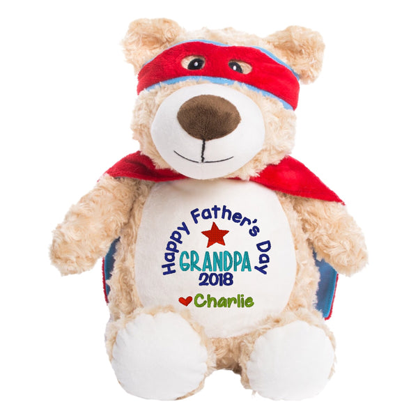 Light brown Shaggy Teddy Bear Plushie with red superhero cape and mask and white belly embroidered with Happy Father's Day Grandpa personalised with the names of the grandchildren