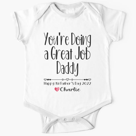 Personalised white short sleeved baby onesie for first fathers day with the words you're doing a great job daddy