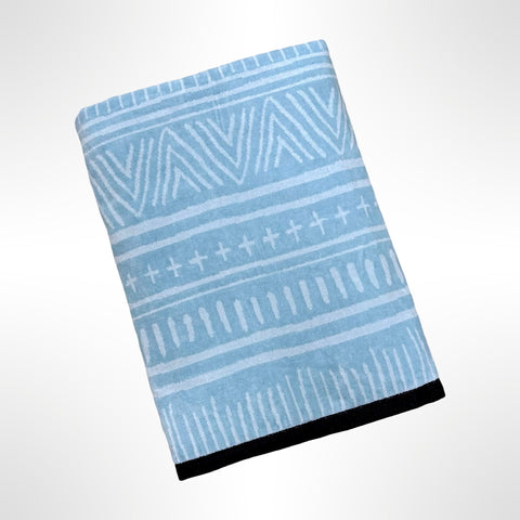 Large personalised beach towel with a white pattern on a light blue background.