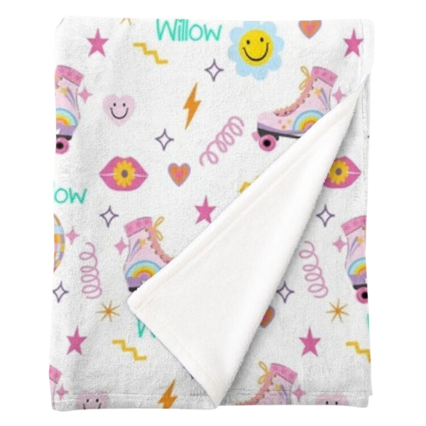 Personalised fleece minky blanket with retro roller-skates, emojis, disco balls and other retro images on a white background