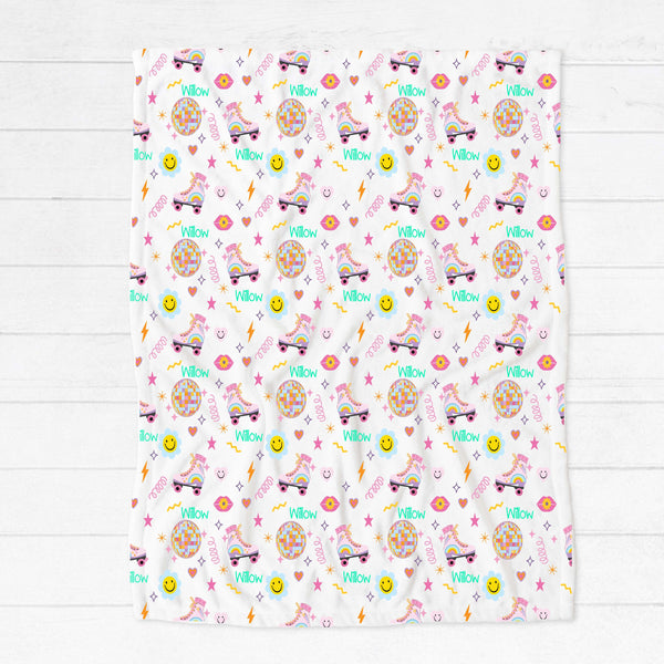 Personalised fleece minky blanket with retro roller-skates, emojis, disco balls and other retro images on a white background