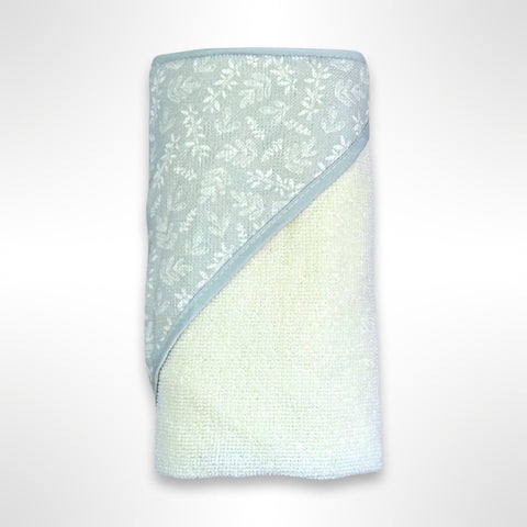 Cream personalised baby hooded towel with a sage green hood with a cream leaf pattern on it.