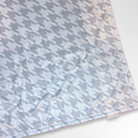 Minky blanket with a grey and white space invader like pattern, ready to be personalised with a name.