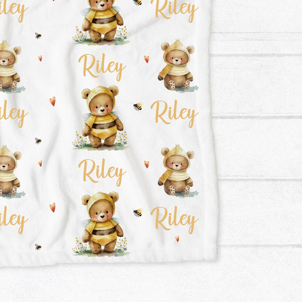 Personalised fleece minky blanket with cute teddies dressed up as bees surrounded by tiny bees and yellow hearts
