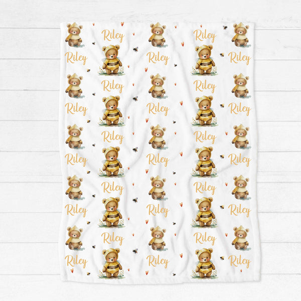 Personalised fleece minky blanket with cute teddies dressed up as bees surrounded by tiny bees and yellow hearts