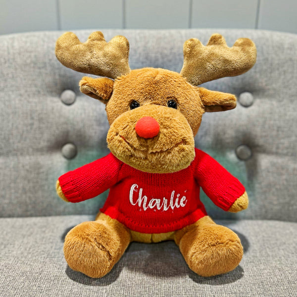 Reindeer christmas softie wearing a personalised red knitted jumper.
