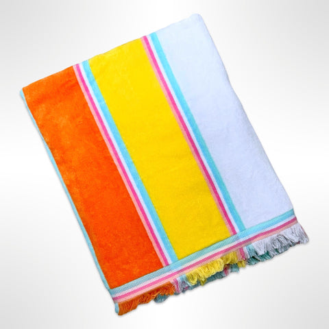 Large personalised beach towel with large stripes in orange, yellow, white, pink and blue, with a fringed edge.