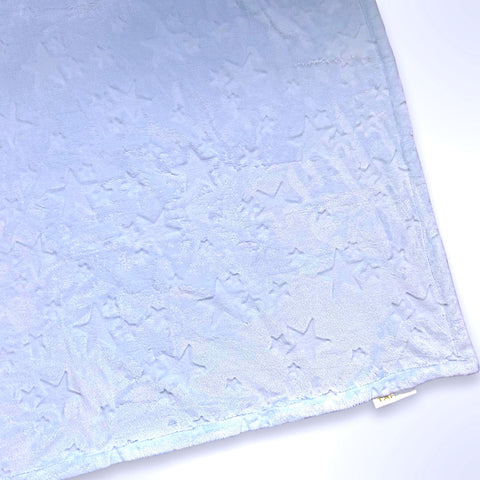 Minky blanket with embossed stars on a pale blue background, ready to be personalised with a name.