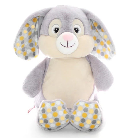 Grey coloured bunny plushie teddy with long grey ears and spotty accent fabric in the ears and on the feet pads that has a lighter cream coloured belly that is ready for personalisation.