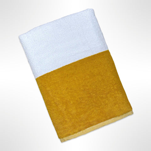 Large beach towel with alternating wide stripes of white and mustard, ready to be personalised with a name.