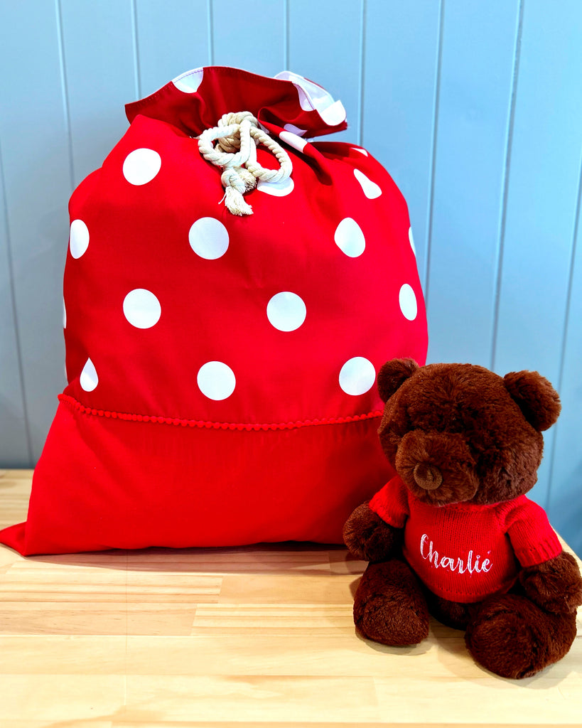Large personalised Santa sack - red fabric with large white spots with a red panel down the bottom for personalisation.