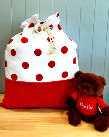 Large personalised Santa Sack - main fabric is white with large red spots - with a large red panel at the bottom for personalisation.