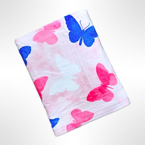 Large personalised Beach Towel with pink, white and blue butterflies on a light pink background.