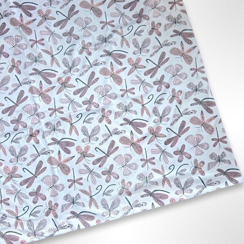 Double layer minky fleece blanket with a light pink butterfly and dragonfly pattern ready to be personalised with an embroidered name.