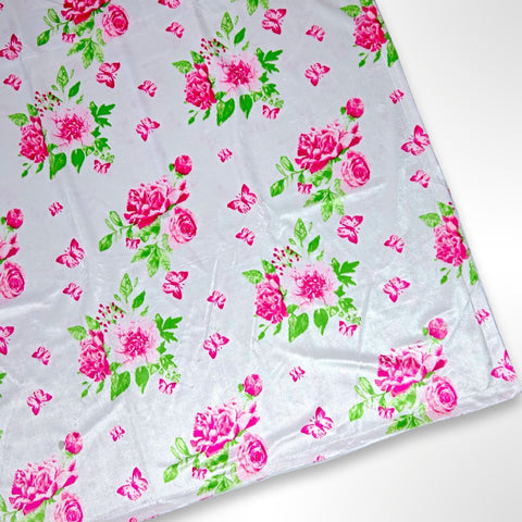 Double layer minky fleece blanket with bright pink flowers and butterflies on a light pink background ready to be personalised with an embroidered name