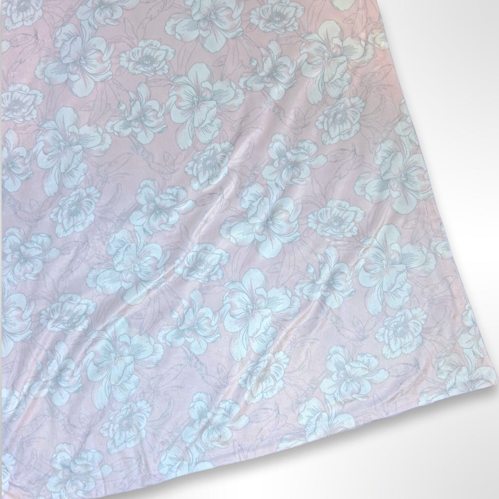 Minky blanket with pink and grey orchid flowers on a light pink background, ready to be personalised with a name.