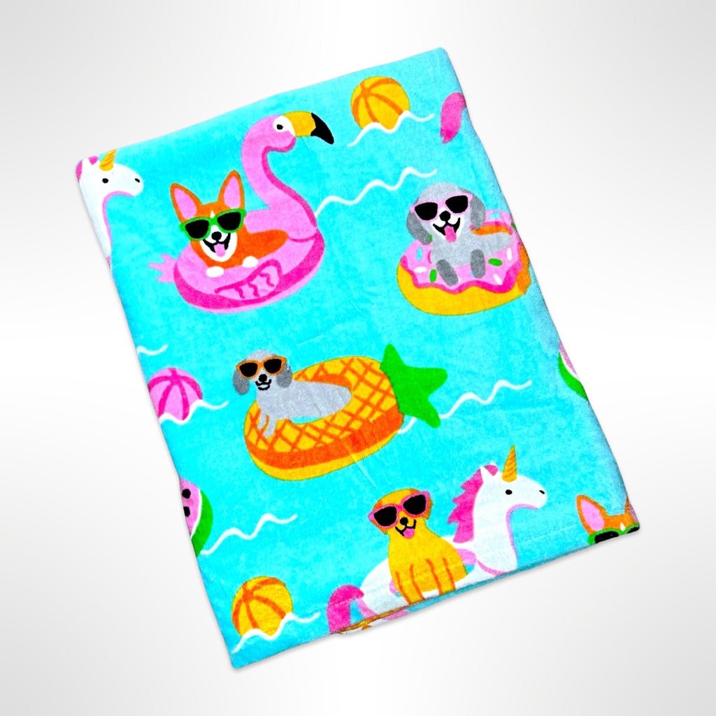 Large children's beach towel with various breeds of pups on inflatable toys in a pool.