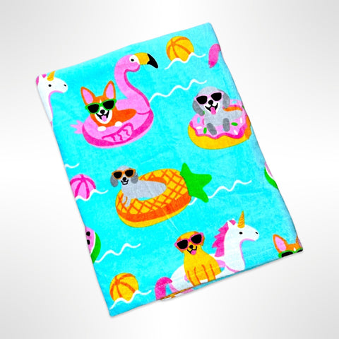 Large children's beach towel with various breeds of pups on inflatable toys in a pool.