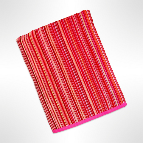 Large personalised beach towel that has stripes in varying shades of red.