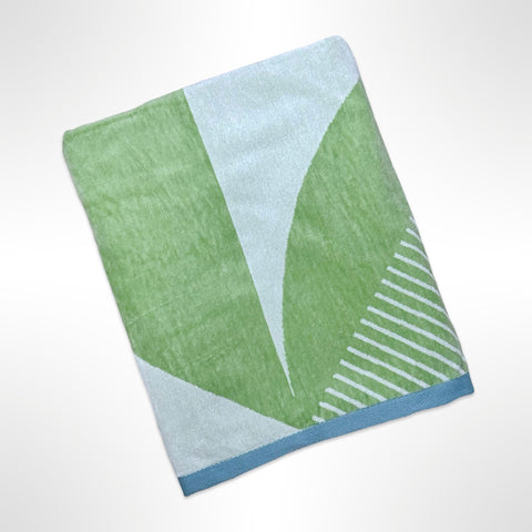 Large personalised beach towel with a geometric print in shades of sage green.