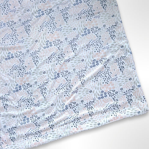 Double layer minky fleece blanket with a navy and pink leaf and floral pattern ready to be personalised with an embroidered name