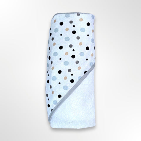 White personalised baby hooded towel with the hood covered in grey, black, silver and gold spots.