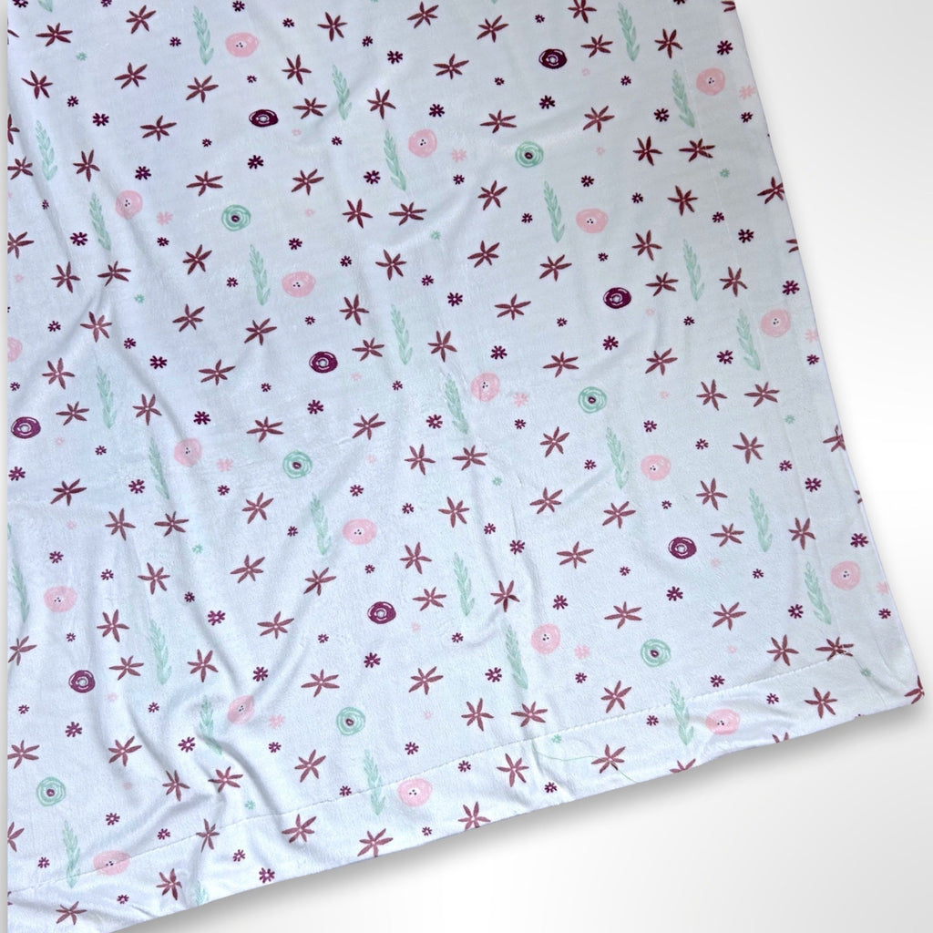 Double layer minky fleece blanket with a whimsical pink, mint and Burgundy flower and leaf pattern ready to be personalised with an embroidered name