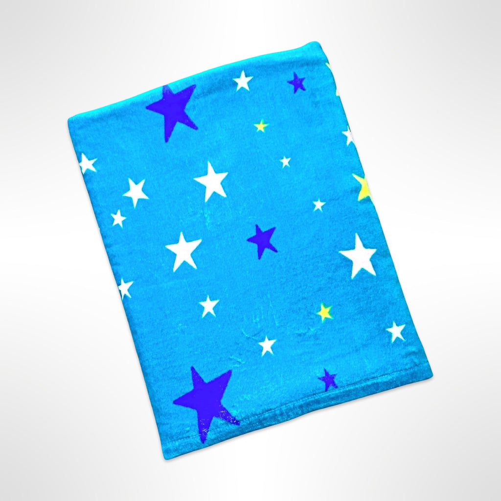 Children's beach towel with blue, white, green and pink stars on a darker blue background.