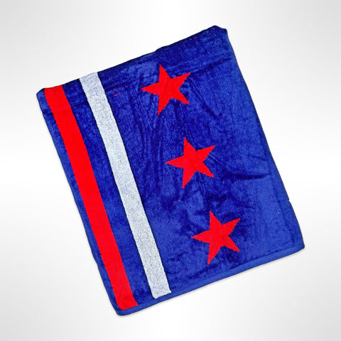 Large personalised beach towel with red stars on a blue background on one side and red, white and blue stripes on the other half of the towel.