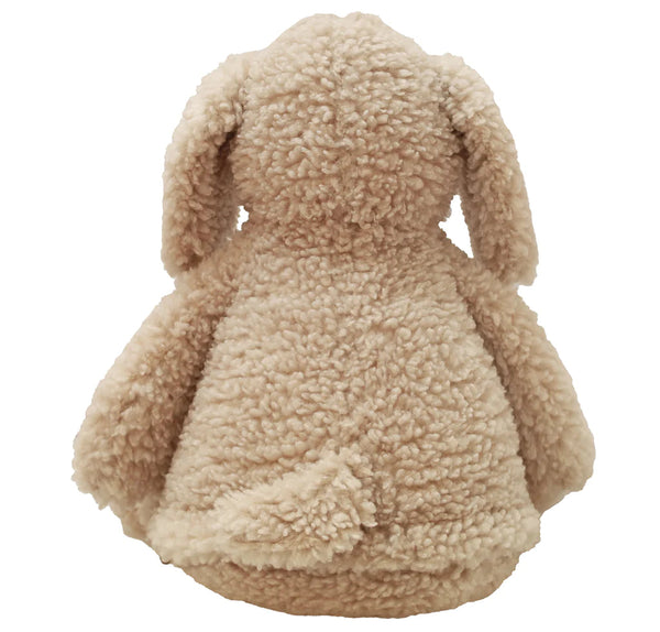 Back view of a light beige coloured dog plushie teddy with long ears and long snout.