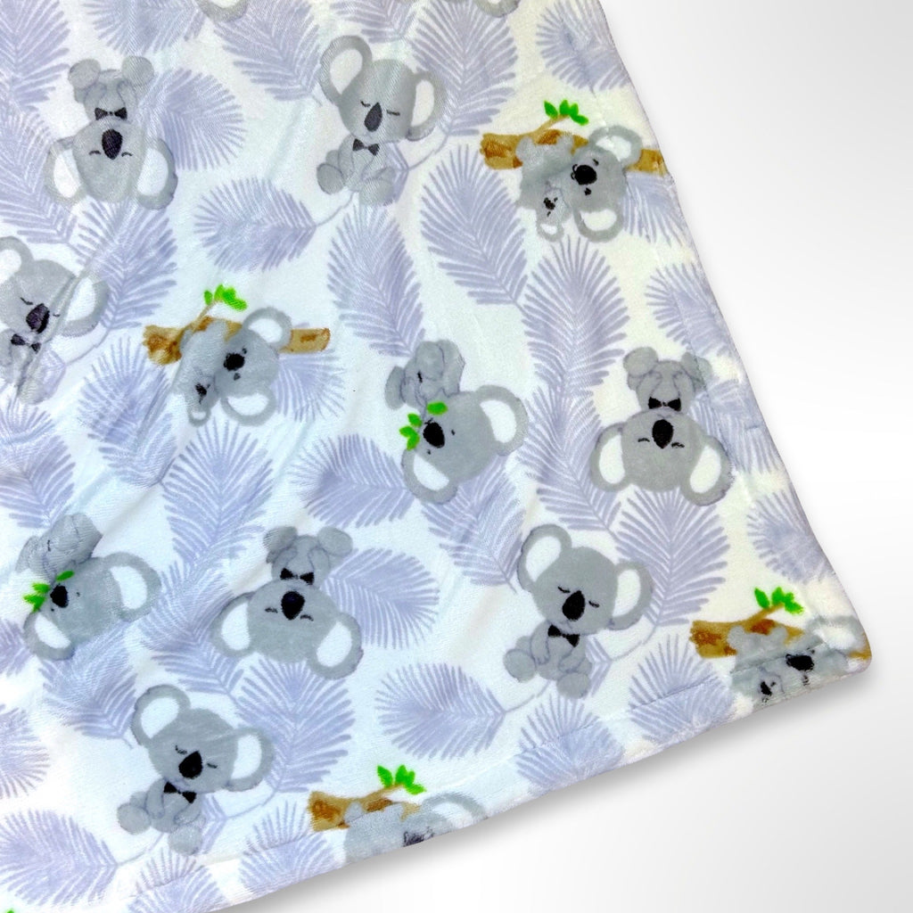Double layer minky fleece blanket with grey koalas sitting on a gum tree branch on a white background ready to be personalised with an embroidered name