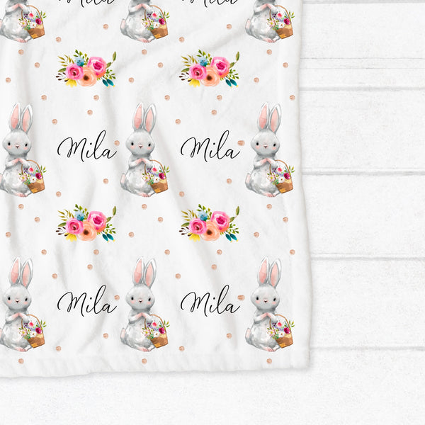 Personalised fleece minky blanket with a white bunny holding a basket full of flowers on a white background with gold spots