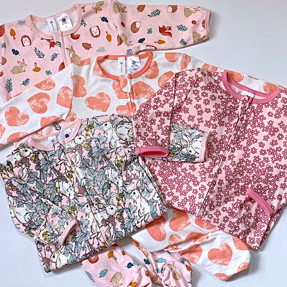 Collection of baby onesies bodysuits used to make a memory keepsake bear