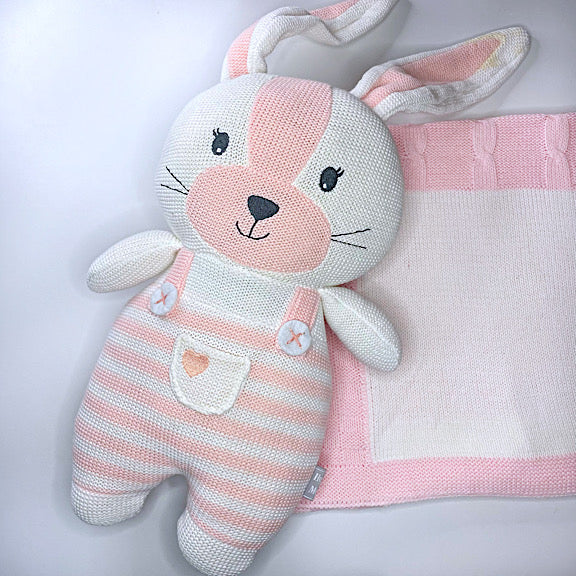 Pink and white knitted soft toy first easter bunny