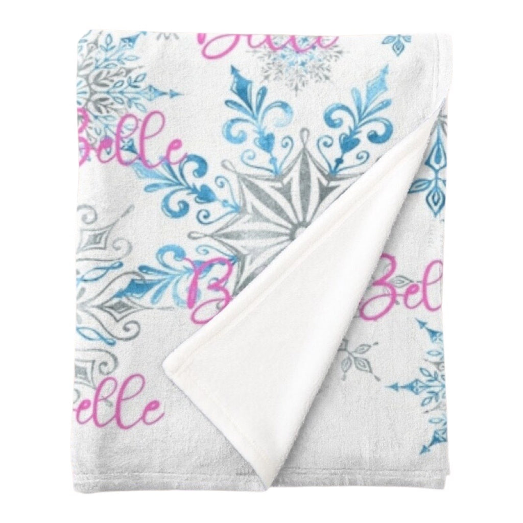 Personalised fleece minky blanket with a myriad of icy blue and silver snowflakes of varying sizes