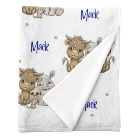 Personalised fleece minky blanket with a trio of African animals - a cow / buffalo, hippopotamus and meerkat