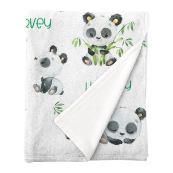 Personalised fleece minky blanket with a black and white panda in various positions eating bamboo