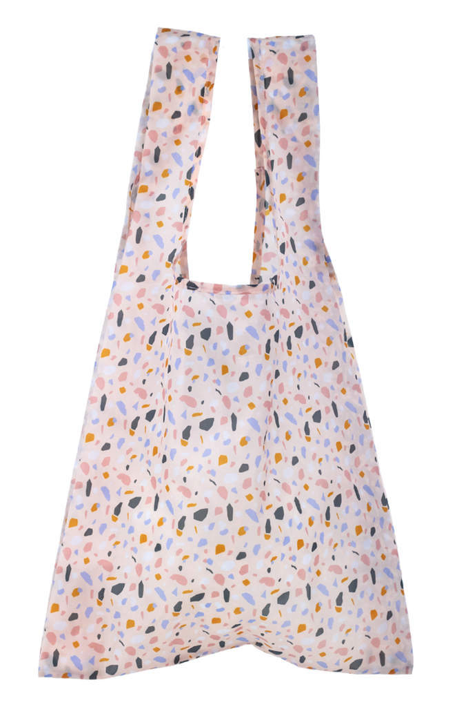 Montiico reusable shopper bag in a light pink terrazzo print.