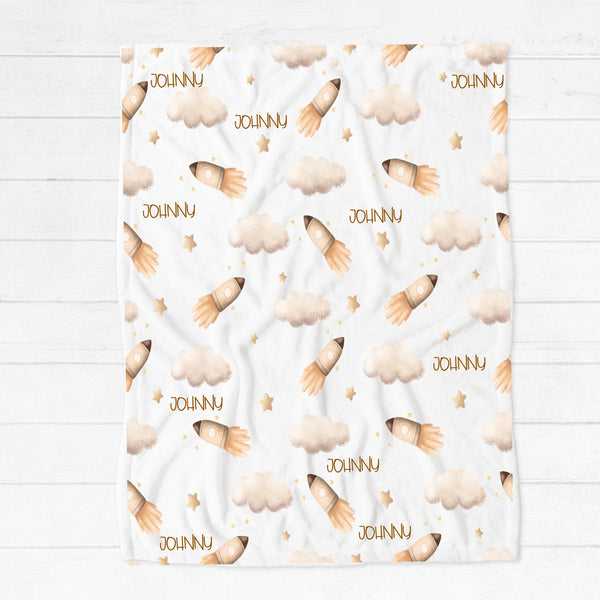 Personalised fleece minky blanket with a rocket taking off among the clouds and stars