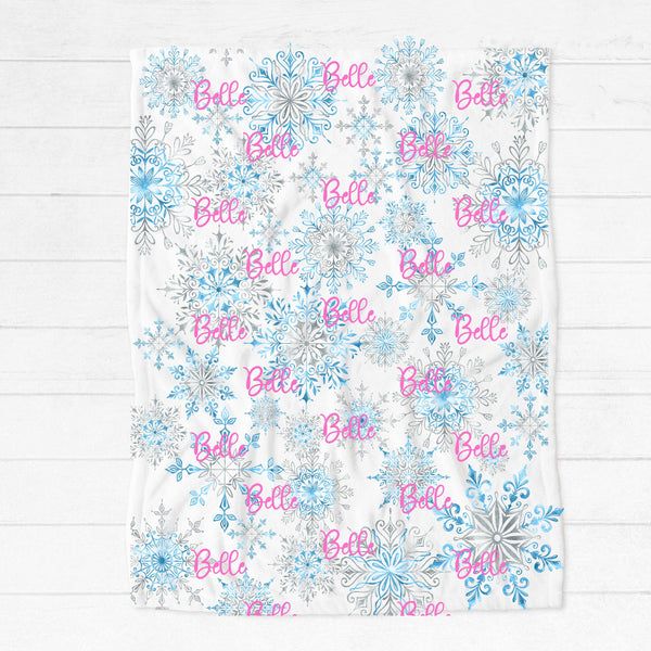 Personalised fleece minky blanket with a myriad of icy blue and silver snowflakes of varying sizes