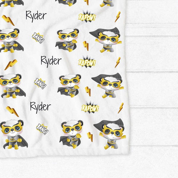 Personalised fleece minky blanket with a panda superhero in a yellow, black and  grey outfit